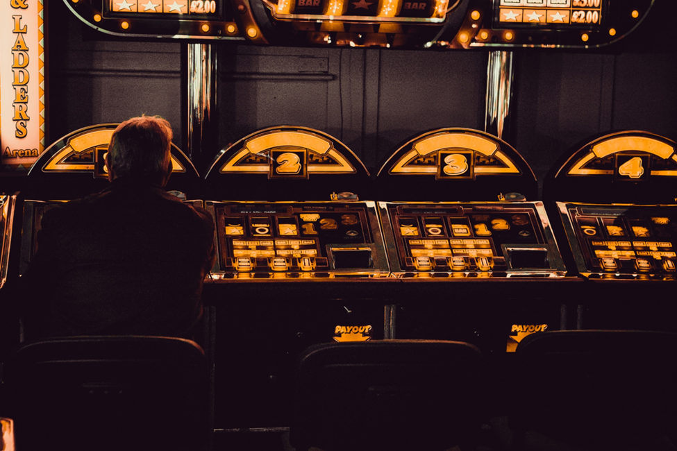 Man playing arcade machine